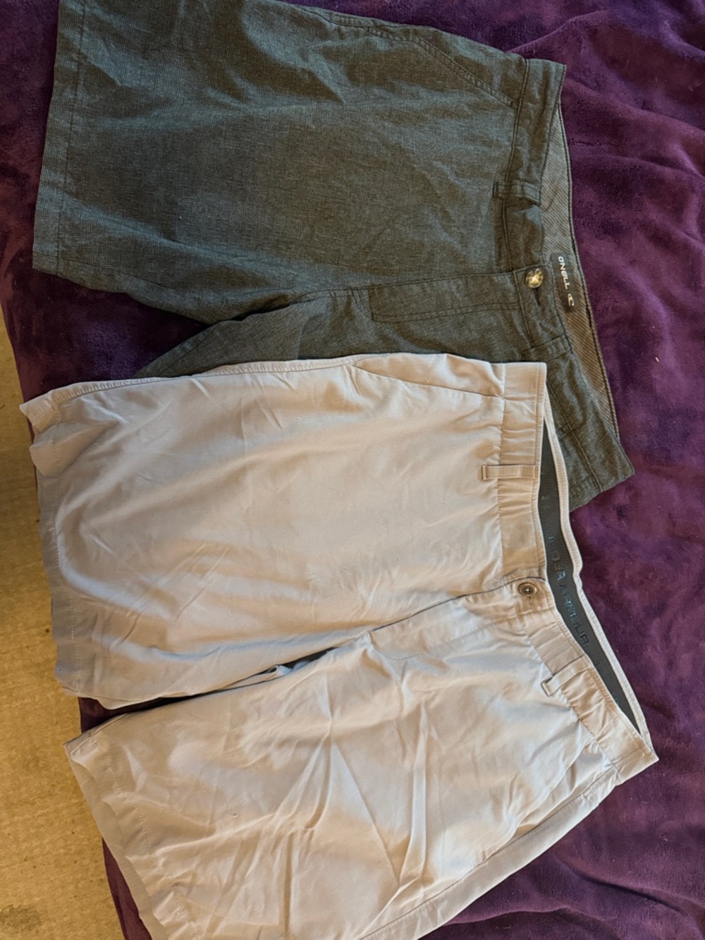 2 pairs men’s shorts.  Brands: O’Neill and Under Armor size 38